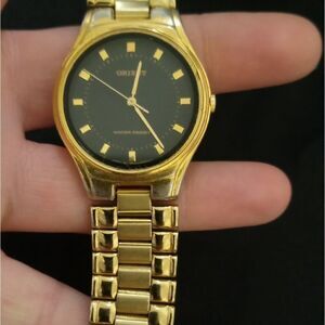 Golden Orient watch with a dark blue face